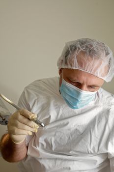 Doctor wearing a face mask on   white background .