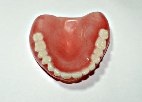 Dental removable prosthesis on white background .