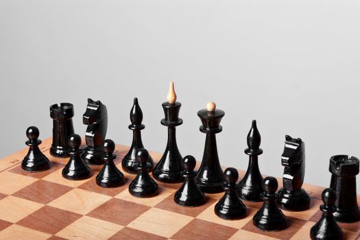 the chess on board on a grey background