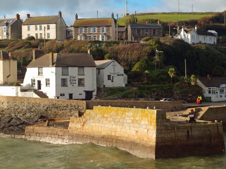 The harbour at Porthleven in Cornwall and the Ship Inn which is claimed to be the oldest building in the village