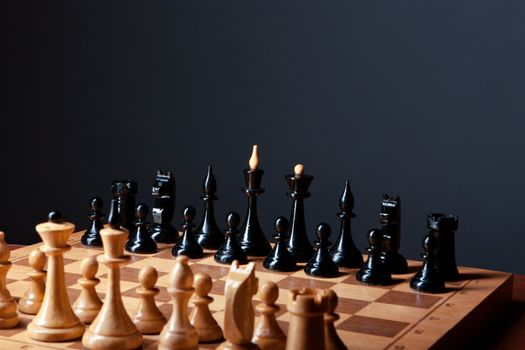 chess board closeup on a dark background