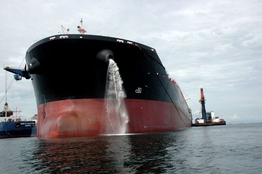 a large coal tanker, which was anchored in the middle of the ocean