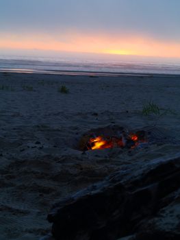 Beach Campfire at Dusk with Ocean in the background