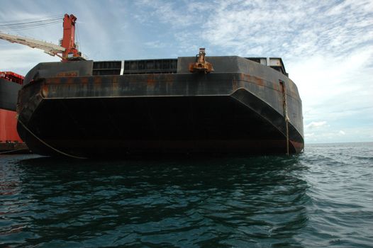 large pontoon boats transporting coal