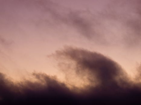 Lavendar Pink Clouds in the Sky at Sunset at the Beach