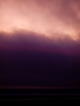 Lavendar Pink Clouds in the Sky at Sunset at the Beach