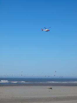 A Coast Guard Helicopter Patrolling the Shoreline on a Clear Day