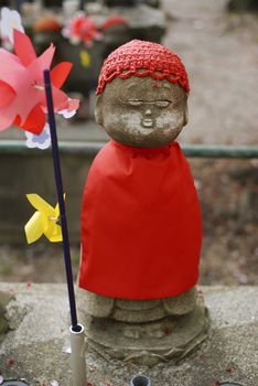 traditional sculpture of japanese jizo in Zojoji temple, Tokyo