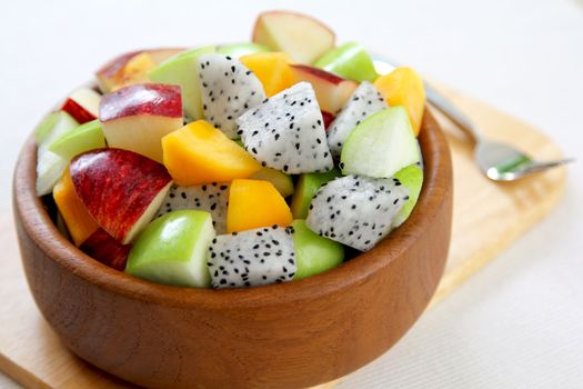 Fruit salad  [ varietie of fruit salad in a wood bowl ]