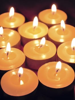 candles lights background, shallow DOF; focus on two front candles
