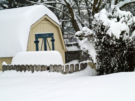 A Heavy Snowfall Piles Up in a Backyard