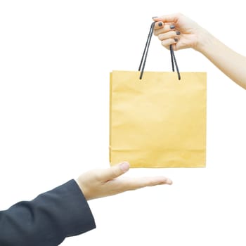 Female keep a brown paper  bag for businessman hand
