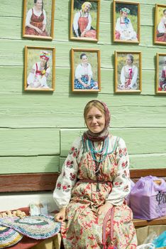The young girl in traditional to Russian clothes. Taken in Myshkin village, Russia on July 2012.
