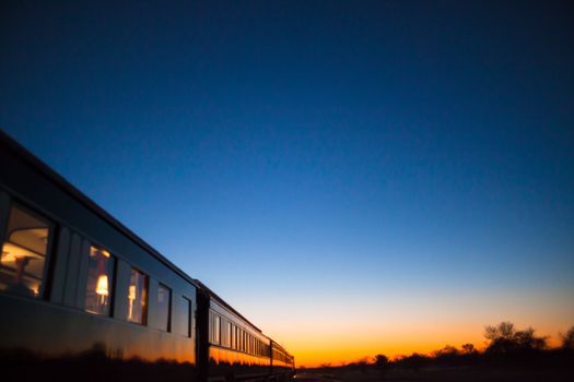 Vintage train going off into the sunset