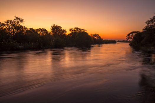 The Zambezi River at dusk, seen from Zambia