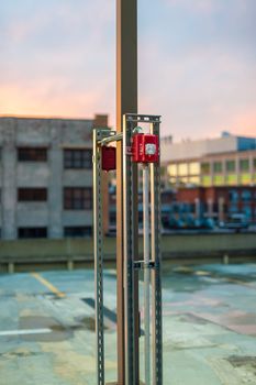 Outdoor fire alarm pull switch in an industrial area