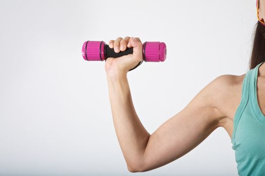 woman arm at gym lifting dumbbells over white background