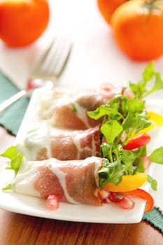Smoked ham with vegetables and pomegranate