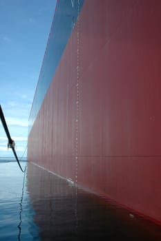 the view from side of a big tanker ship, which was anchored in the middle of the ocean