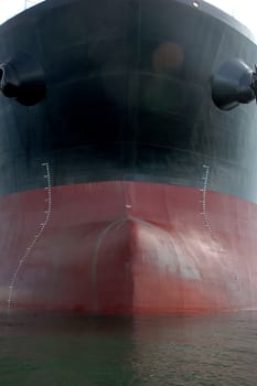 the bow of a big tanker ship, which was anchored in the middle of the ocean
