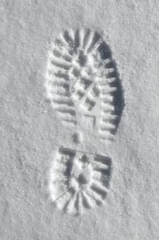 detailed sole imprint in deep snow background