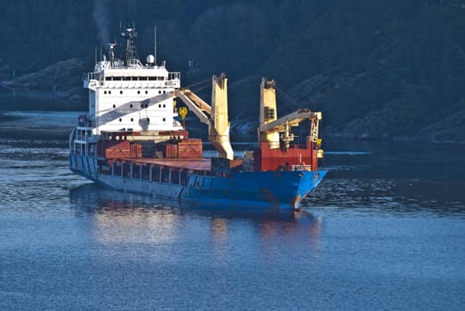 ringdalsfjord is a boundary fjord of norway and sweden, it extends from the oslo fjord and to halden, where it goes into iddefjord, picture is shot from svinesund bridge and shows bbc europe on the way out of the fjord, bbc europe is a cargo ship, is 120X20 meters and sails under antigua barbuda [ag] flag.