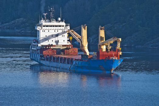 ringdalsfjord is a boundary fjord of norway and sweden, it extends from the oslo fjord and to halden, where it goes into iddefjord, picture is shot from svinesund bridge and shows bbc europe on the way out of the fjord, bbc europe is a cargo ship, is 120X20 meters and sails under antigua barbuda [ag] flag.