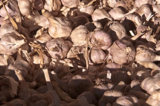 Stall of garlic at the market .