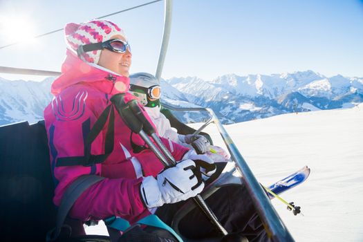 Happy skiers on a ski-lift of Zell am Ziller, Tirol, Austria