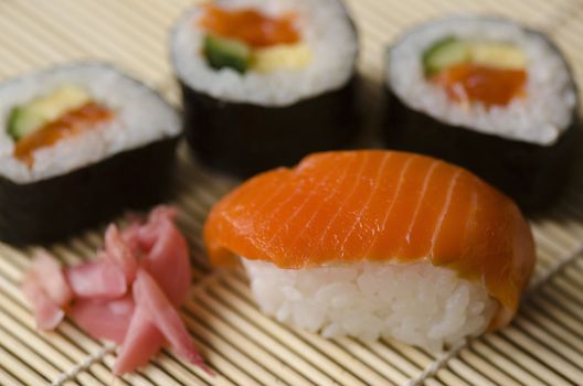 Japanese Cuisine, Sushi Set: Salmon, Conger and Tuna Sushi with Salad Leaf. Nigiri, Maki Sushi and Sashimi