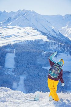 Snowboarder on the Alpine skiing resort in Austria Zillertal