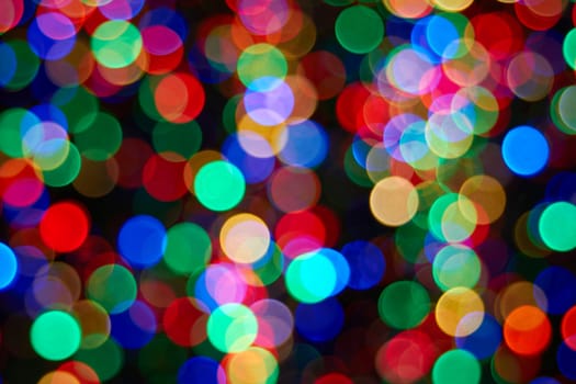 Christmas Tree with Colorful Out of Focus Blurred Light on Black Background Closeup
