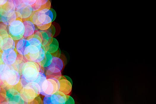 Out of Focus Colorful Blurred Lights Border on Black Background