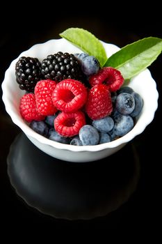 Big Pile of Fresh Berries on black background