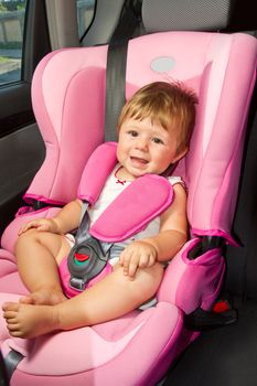 baby in a safety car seat. Safety and security
