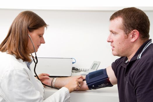 Blood pressure measuring. Doctor and patient.