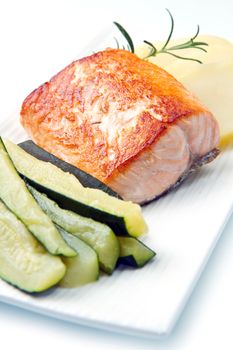 Grilled salmon with potatoes and zucchini