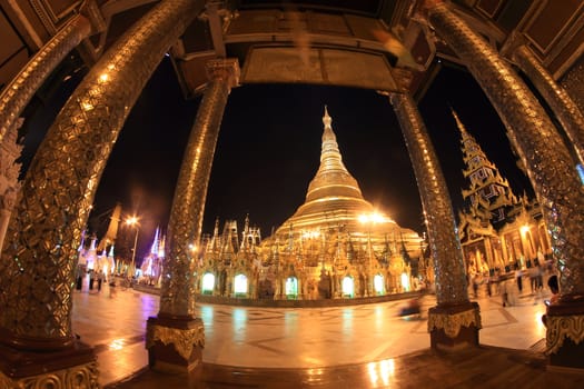 YANGON, MYANMAR - NOVEMBER 18: Buddhist devotees pray at the full moon festival, Shwedagon Pagoda, NOVEMBER 18, 2012 in Yangoon, Myanmar (Burma).