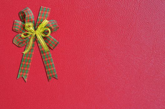 Gift bow on red background