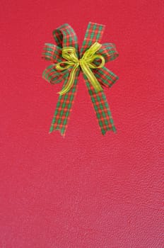 Gift bow on red background