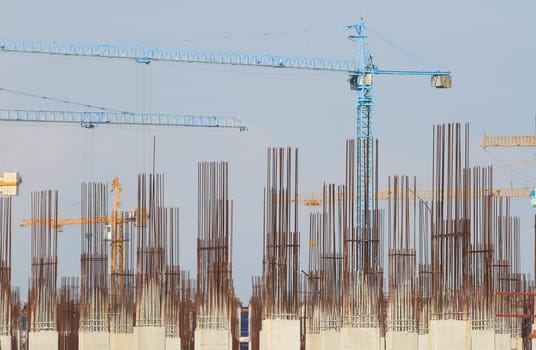 Construction site with enforced concrete steel frames rising up