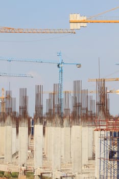 Construction site with enforced concrete steel frames rising up