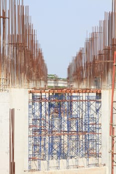 Construction site with enforced concrete steel frames rising up
