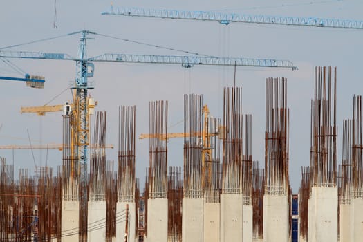 Construction site with enforced concrete steel frames rising up