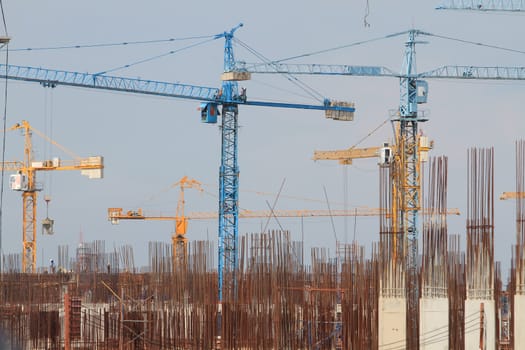 Construction site with enforced concrete steel frames rising up