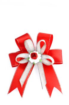 Christmas red, silver gift bow isolated on white