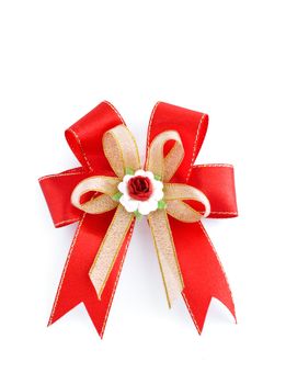 Christmas red, gold bow isolated on white