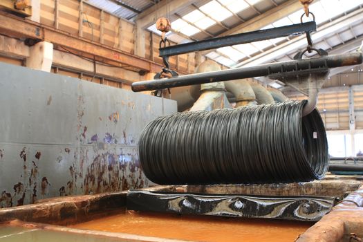 Large spools of Steel Coils being moved.