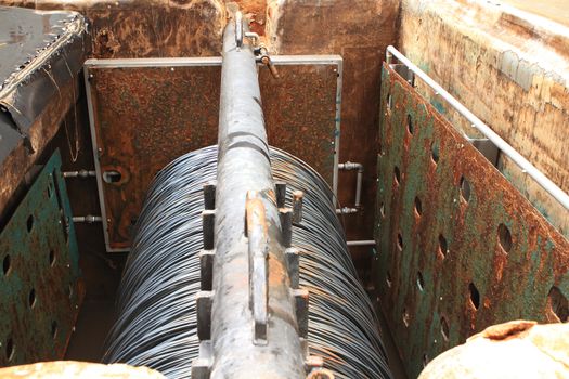 Large spools of Steel Coils being moved.