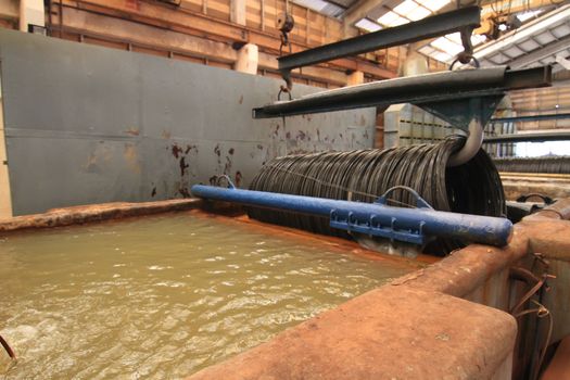 Large spools of Steel Coils being moved.